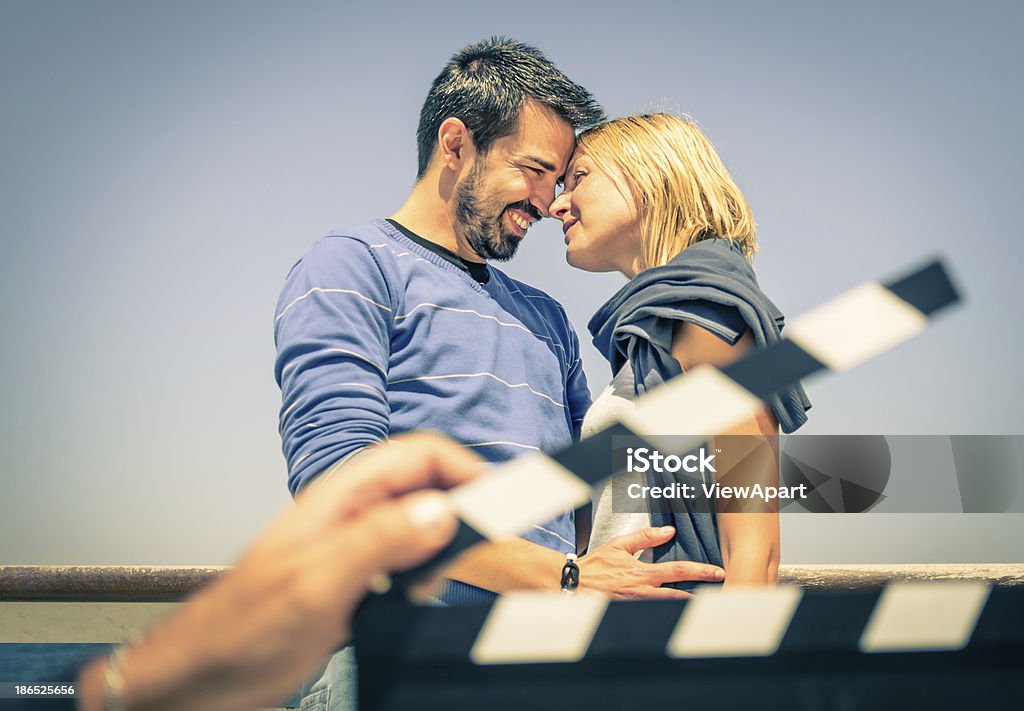 Couple of Lovers like in a Movie Film slate starting a love scene in a real life movie. Director's Cut Stock Photo