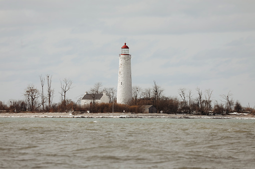 Gananoque, Ontario, Canada - May 20, 2018: Gananogue Lighthouse in Joel Stone Heritage Park on St. Lawrence River. Tourism in Ontario, Canada.