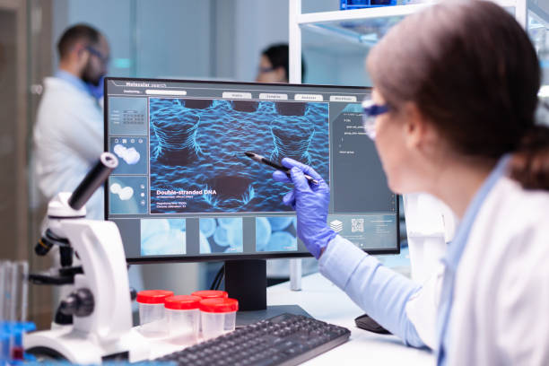 istock Professional biochemist analysing a medical experiment 1865313373