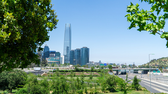 Panoramic view of Santiago, Chile, showcasing the modern skyline adorned with sleek glass skyscrapers.