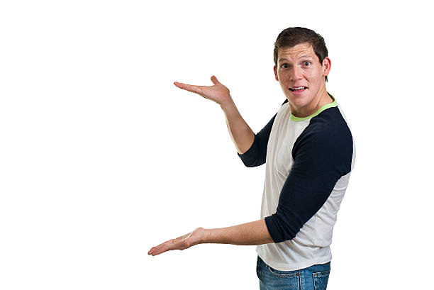 istock Handsome guy holding out your product on white 186533246