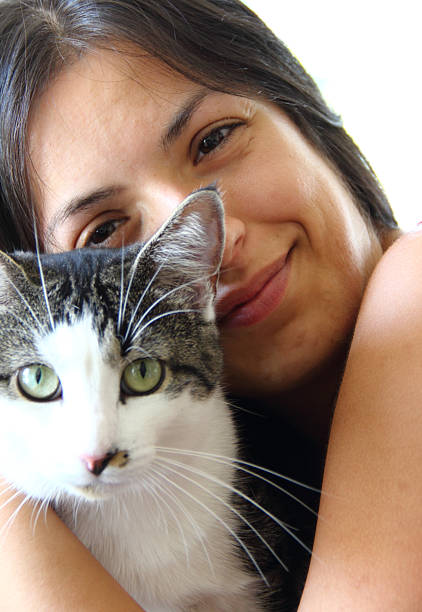 istock Young woman with cat 186534036