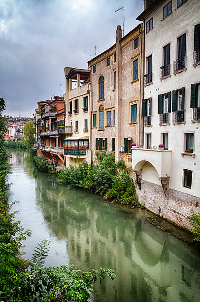 istock Traditional Italian Buildings by a River 186535616