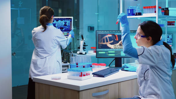 istock Group of scientists wearing lab coat working in laboratory 1865360998