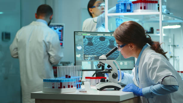 istock Microbiologist working late at night for new vaccine 1865365256