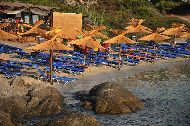istock sandy beach with sunbeds in the Greek 186537178