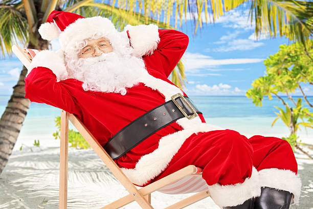 istock Santa Claus sitting on beach chair 186539092