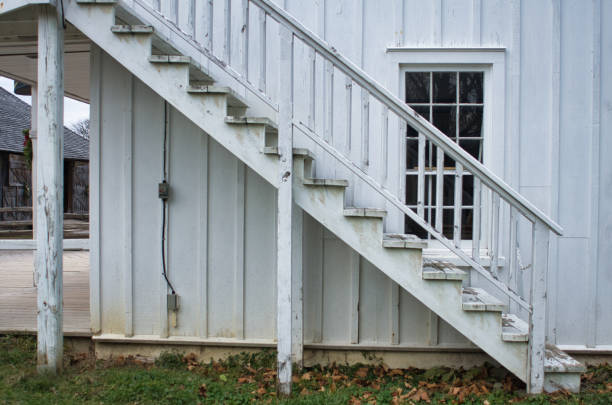 istock white wooden staircase leading up to the second floor 1865404220