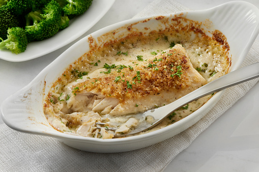 Creamy Parmesan Baked Halibut Fillet with Seasoned Bread Crumbs and Steamed Broccoli