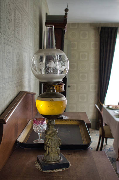 istock antique oil lamp on a bureau 1865410053