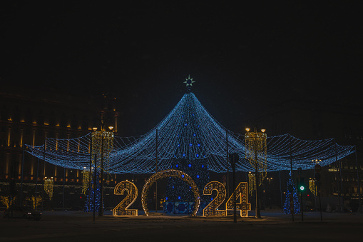 A Christmas tree and the inscription New Year 2024 on a Moscow street