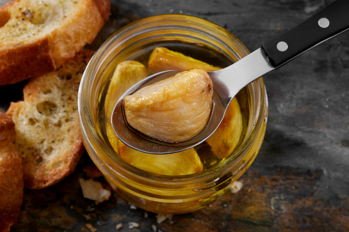 Garlic Confit Roasted in Olive Oil with toasted Baguettes