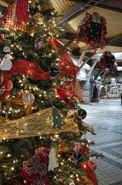 istock decorated christmas tree with festive atmosphere inside a building 1865413187