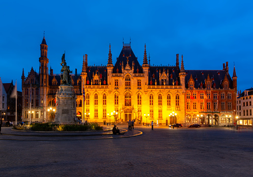 Provincial Court building on Market square (Grote markt) at night, Bruges, Belgium