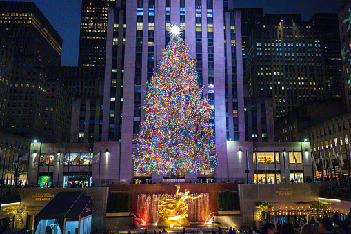 The Christmas tree and Prometheus statue at Rockefeller Center. December 2023. New York City, NY. USA