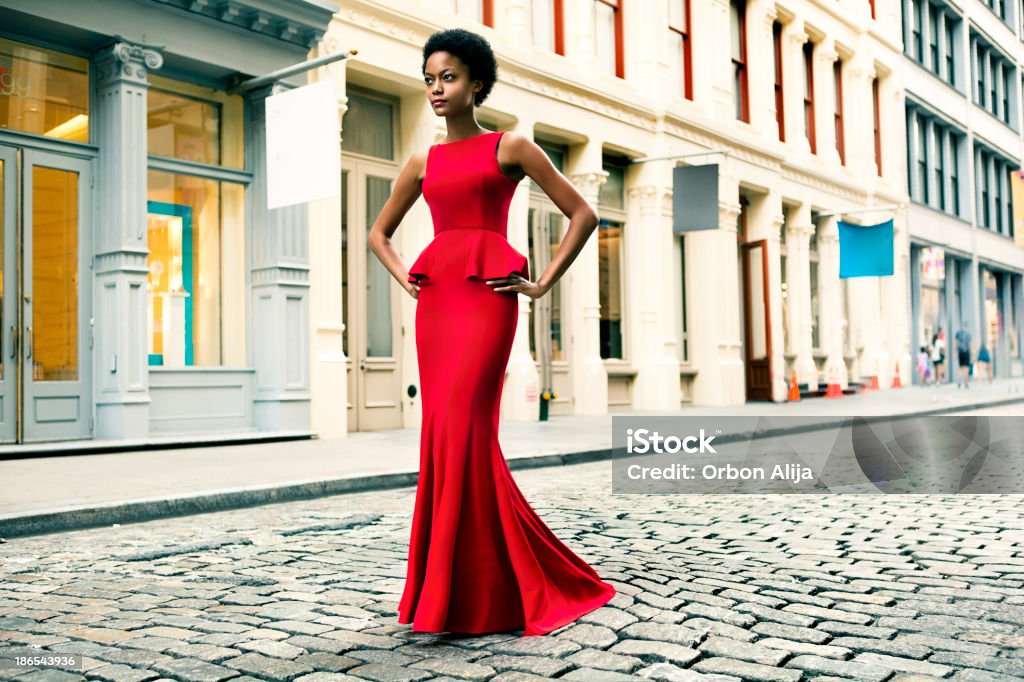 Fashion in New York City Woman wearing a red gown in Soho, New York Women Stock Photo