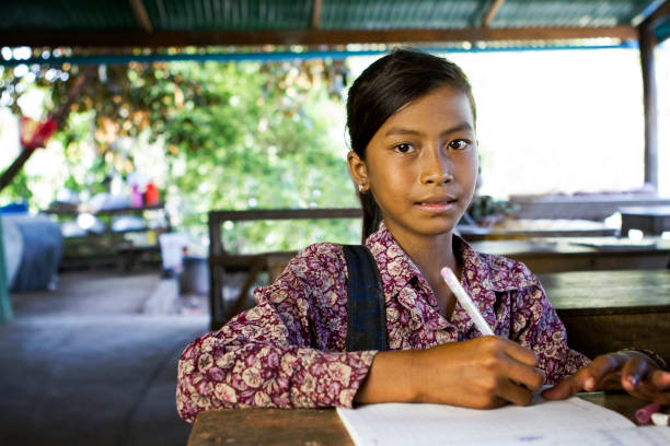 Asian school girl at school A young and thoughtful school girl in Cambodia. cambodian culture stock pictures, royalty-free photos & images
