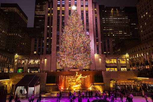 The Christmas tree and ice skaters at Rockefeller Center. December 2023. New York City, NY. USA