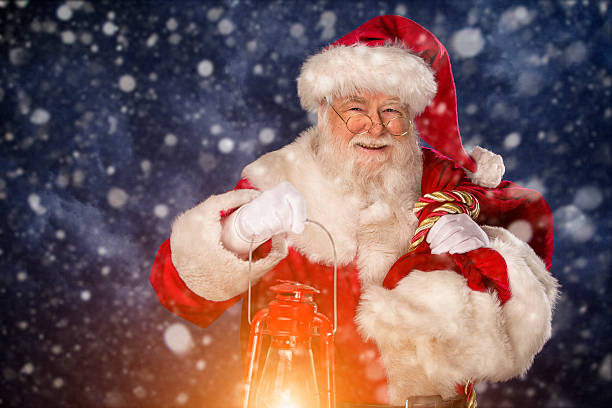 Pictures of Vintage Real Santa Claus carrying gift sack stock photo