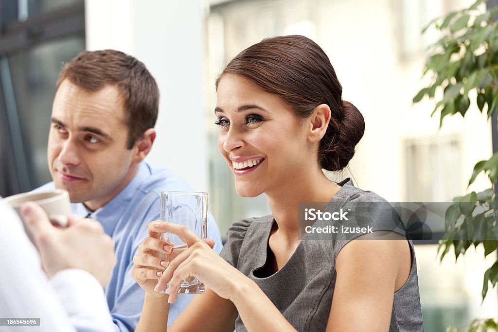 Business lunch Cheerful business people having a lunch break.  Adult Stock Photo