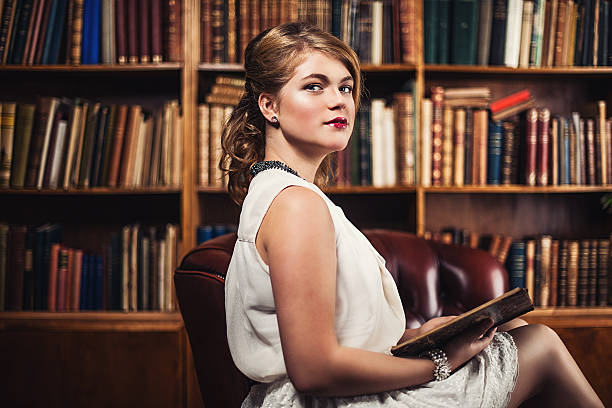 istock Beautiful young woman in library 186545816