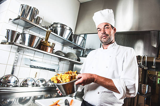 happy chef in gewerbliche küche - ready to cook flash stock-fotos und bilder