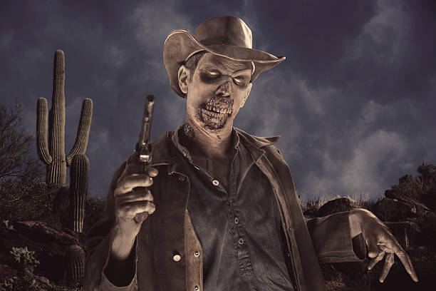 Cowboy Zombie in the desert. This stock image has a horizontal composition and in the desert.