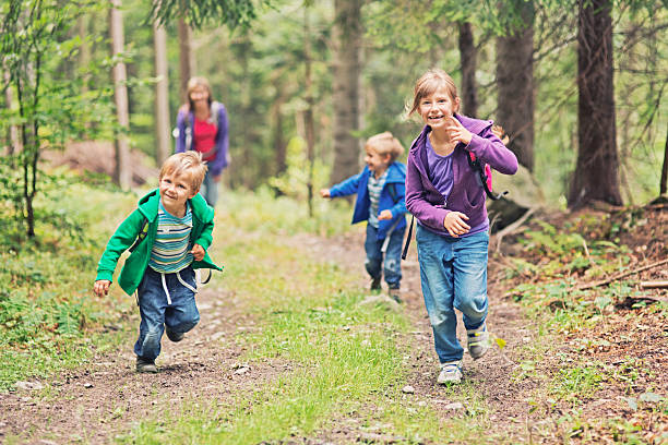 istock Mother and kids hiking 186546560