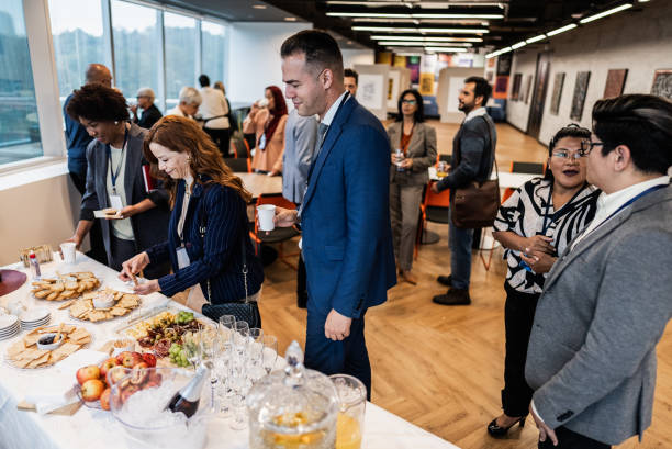 istock Business people getting food during conference coffee break 1865465624