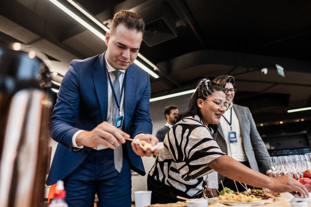 istock Business people getting food during conference coffee break 1865466134