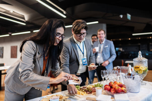 istock Business people getting food during conference coffee break 1865466138