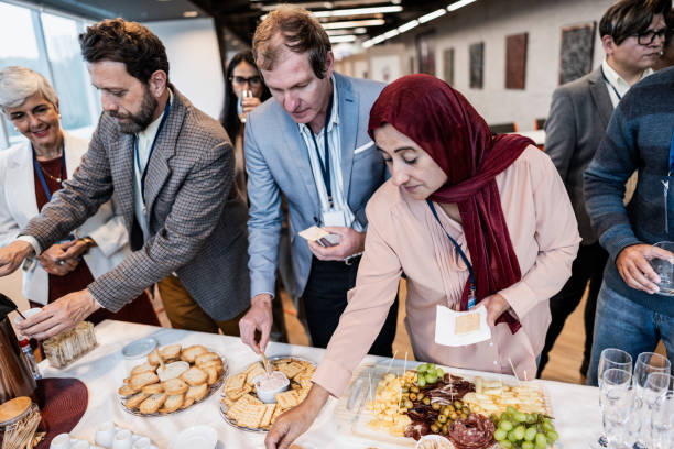 istock Business people getting food during conference coffee break 1865467204