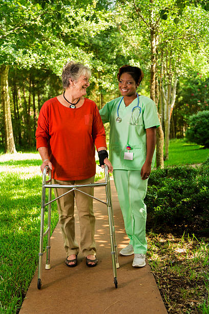 istock Medical:  Happy caregiver and patient taking a walk together. 186546738