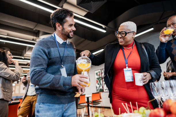 istock Business people getting food during conference coffee break 1865467712