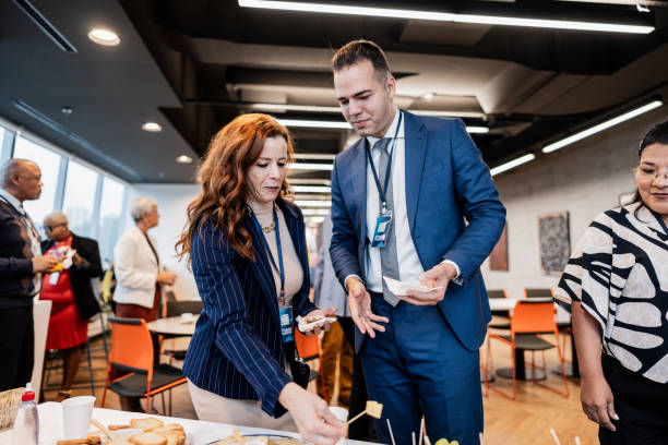 istock Business people getting food during conference coffee break 1865468237