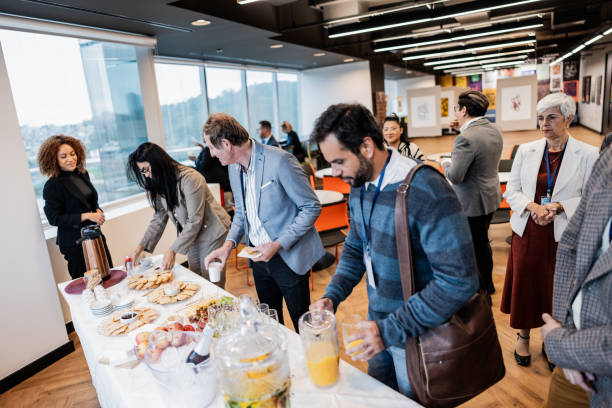 istock Business people getting food during conference coffee break 1865468244