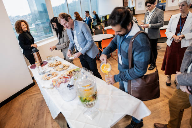 istock Business people getting food during conference coffee break 1865468751