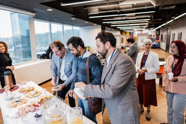 istock Business people getting food during conference coffee break 1865468753