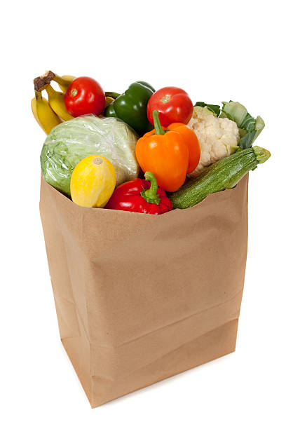 istock grocery sack full of vegetables on a white background 186546910