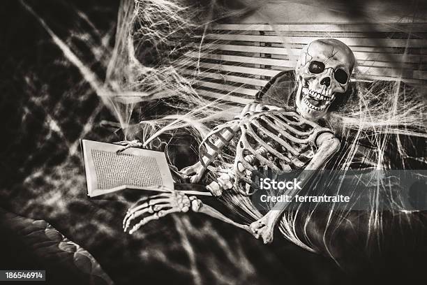 Halloween Bedtime Stories Stock Photo - Download Image Now - Spooky, Horror, Human Skeleton