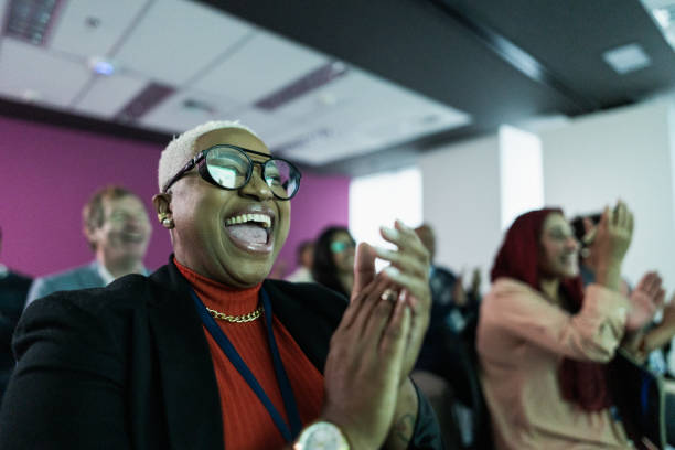 Audience applauding during conference in the office