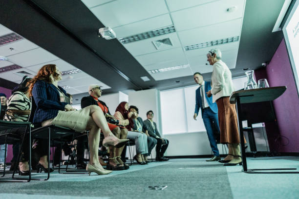 Coworkers doing presentation during conference in the office