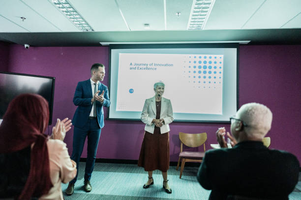 Coworkers doing presentation during conference in the office