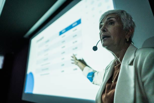 istock Business woman doing presentation during conference 1865494419