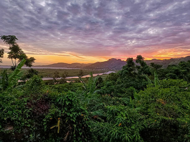 istock Gorgeous green landscape during a cloudy sunset. 1865497627