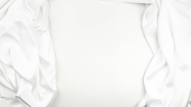 istock Elegant luxurious white silk with soft waves can use as wedding background. Copy space 1865498694