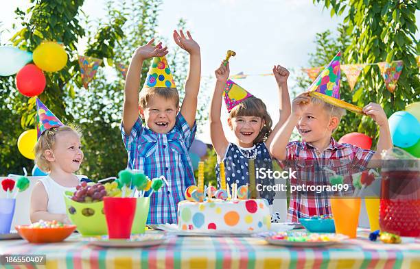 Group Of Children Celebrating At A Birthday Party Stock Photo - Download Image Now - Birthday, Party - Social Event, Celebration