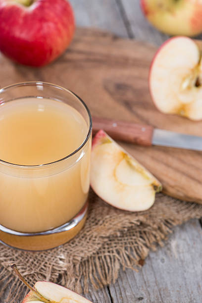 istock Small Glass with fresh Apple Juice 186550477