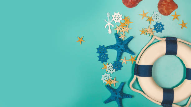 istock summer vacation on beach. Top view composition of starfish on blue background 1865509259