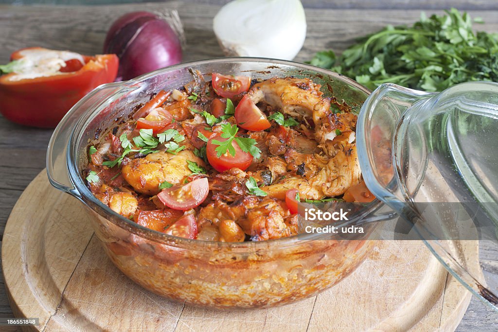 Casserole of chicken in an ovenproof dish Casserole of chicken in an ovenproof dish with vegetables Chicken - Bird Stock Photo